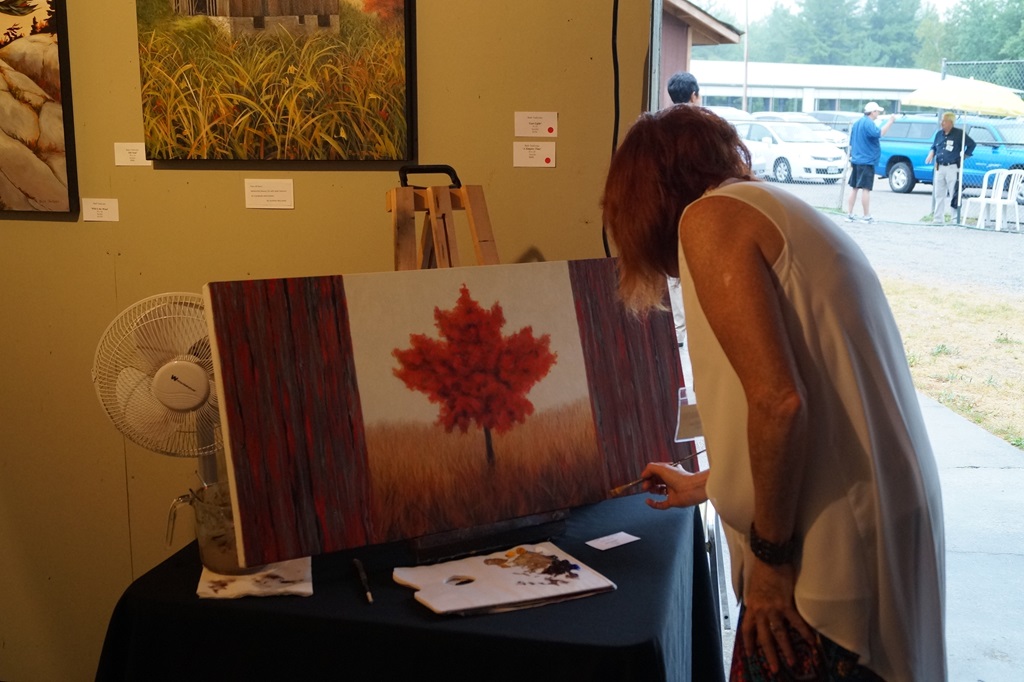 Buckhorn Festival of the Arts- Artist painting Canadian flag