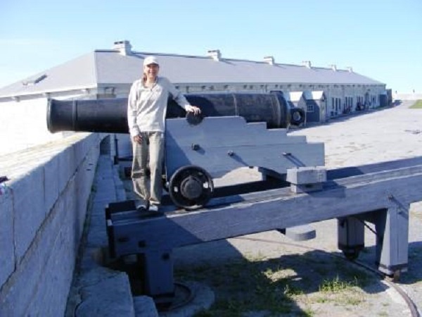 Scoop standing beside a Fort Henry canon