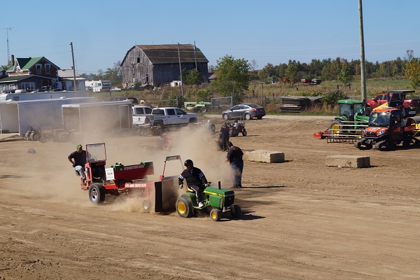 Dirt flies up at the tractor pull