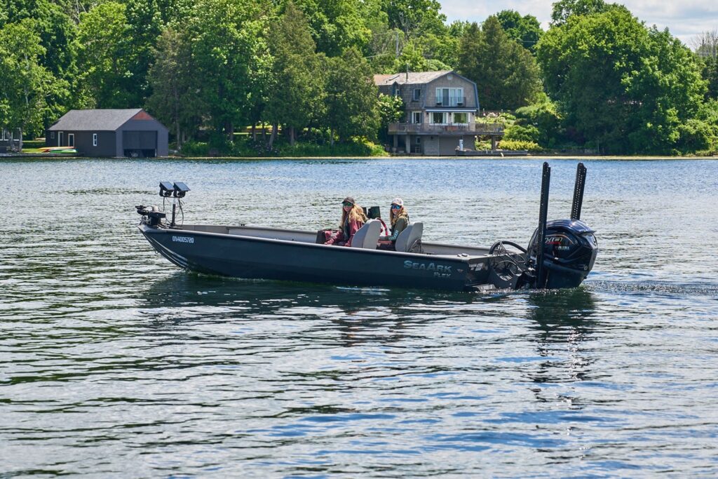 Largemouth Bass Fishing the Rideau River in an aluminum runabout